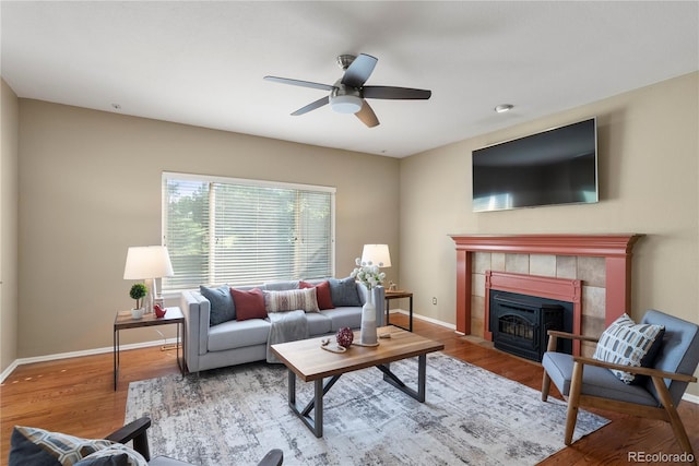 3232 Cimarron Pl, Superior, CO 80027 - living area with a ceiling fan, wood finished floors, and a fireplace