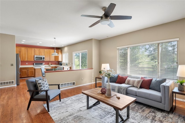 3232 Cimarron Pl, Superior, CO 80027 - living room with light wood-type flooring, a ceiling fan, and recessed lighting