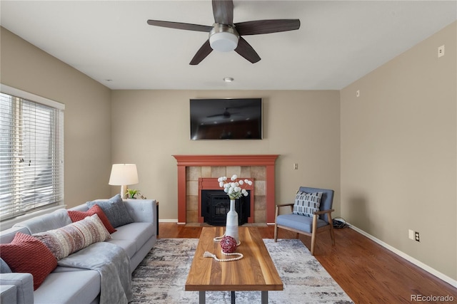 3232 Cimarron Pl, Superior, CO 80027 - living room featuring wood finished floors, ceiling fan, and a tile fireplace