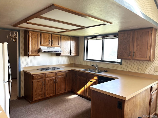 11323 E Cimmarron Dr, Englewood, CO 80111 - kitchen featuring a sink, light countertops, freestanding refrigerator, wallpapered walls, and under cabinet range hood