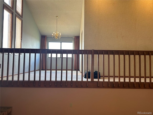 11323 E Cimmarron Dr, Englewood, CO 80111 - details featuring a textured ceiling and an inviting chandelier
