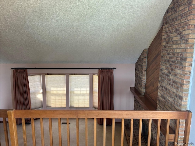 11323 E Cimmarron Dr, Englewood, CO 80111 - stairway featuring a textured ceiling and lofted ceiling