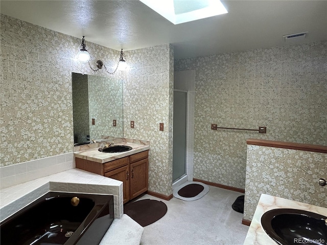 11323 E Cimmarron Dr, Englewood, CO 80111 - bathroom with visible vents, two vanities, a sink, and a stall shower