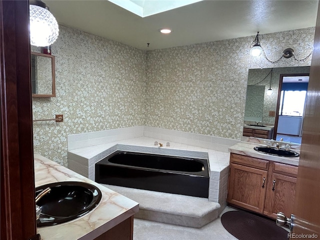 11323 E Cimmarron Dr, Englewood, CO 80111 - bathroom with a sink, a garden tub, wallpapered walls, and two vanities