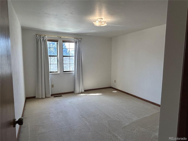 11323 E Cimmarron Dr, Englewood, CO 80111 - carpeted empty room with baseboards and visible vents