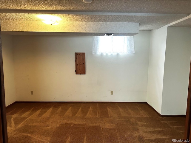 11323 E Cimmarron Dr, Englewood, CO 80111 - basement with dark colored carpet, baseboards, and visible vents