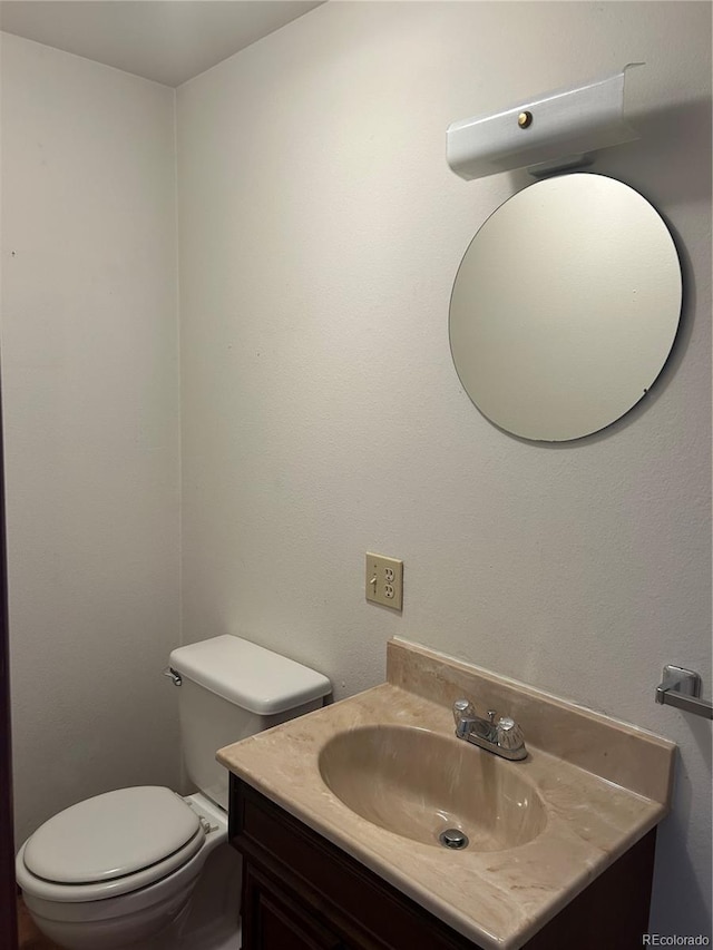 11323 E Cimmarron Dr, Englewood, CO 80111 - half bathroom featuring toilet and vanity