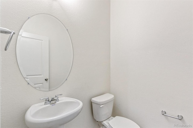 18162 Coppermallow Trl, Parker, CO 80134 - half bathroom with a sink and toilet