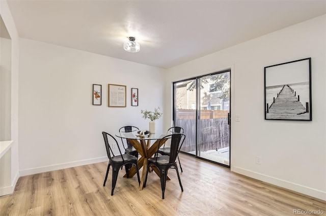 dining area with light hardwood / wood-style flooring