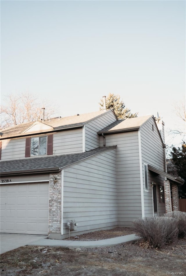 view of side of home featuring a garage