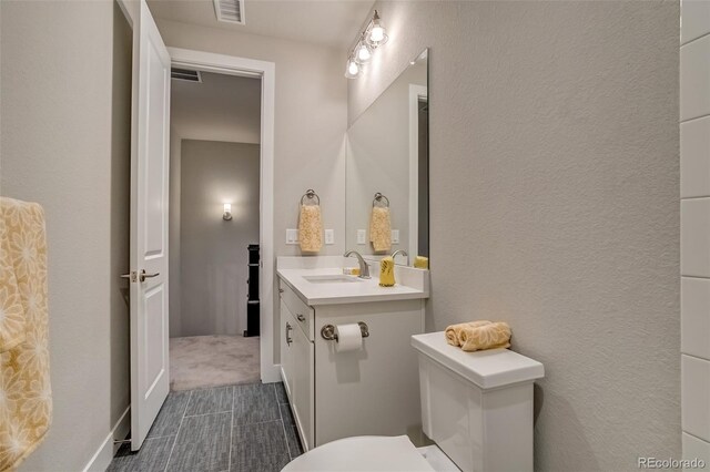 5185 Vivian St, Wheat Ridge, CO 80033 - bathroom with vanity and toilet