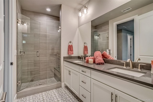 5185 Vivian St, Wheat Ridge, CO 80033 - bathroom with double vanity, tile patterned flooring, a shower stall, and recessed lighting