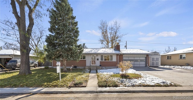 single story home featuring a front yard and a garage