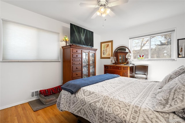 bedroom featuring ceiling fan and hardwood / wood-style floors