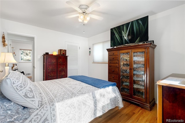 bedroom featuring ceiling fan and wood-type flooring