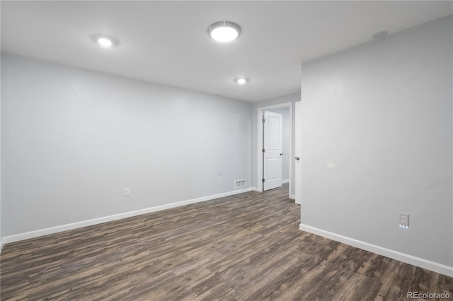 spare room featuring dark hardwood / wood-style floors