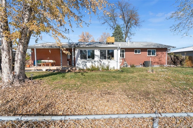 back of property featuring cooling unit, a yard, and a patio