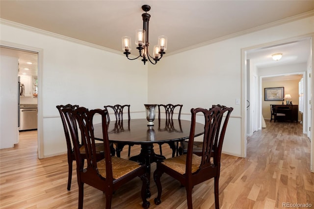 10366 E Ida Ave, Greenwood Village, CO 80111 - dining room with light wood finished floors, ornamental molding, a chandelier, and baseboards
