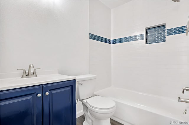 full bathroom with shower / bathtub combination, vanity, and toilet