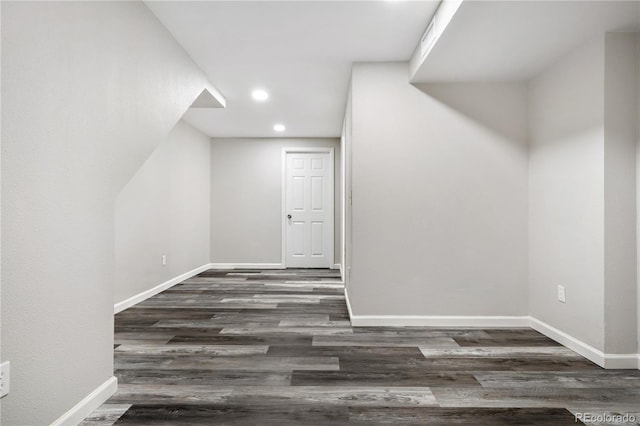 additional living space featuring dark wood-type flooring