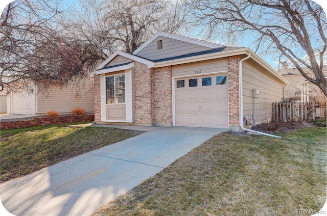 garage featuring driveway and fence