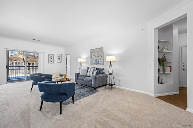 carpeted living room featuring built in shelves and crown molding