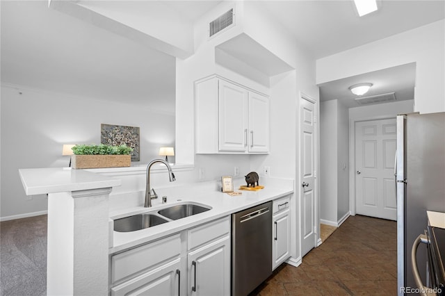 kitchen featuring kitchen peninsula, sink, stainless steel appliances, and white cabinetry