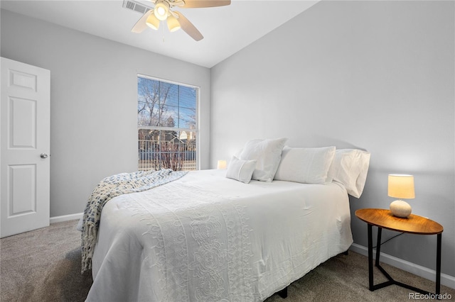 bedroom with ceiling fan, carpet flooring, and lofted ceiling