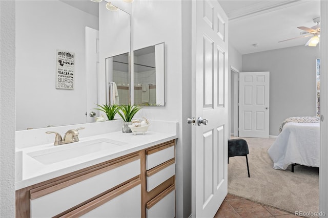 bathroom featuring ceiling fan, tile patterned floors, and vanity