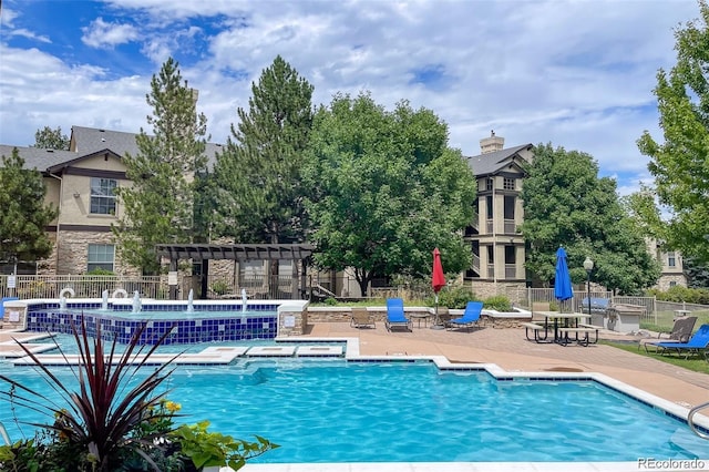 view of pool with a patio and a pergola