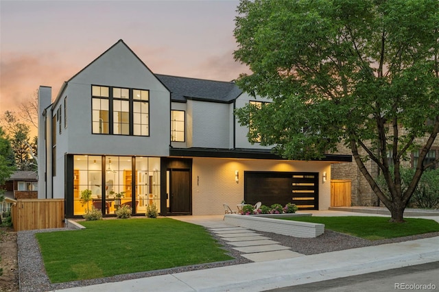 171 S Dexter St, Denver, CO 80246 - contemporary house with an attached garage, driveway, and stucco siding