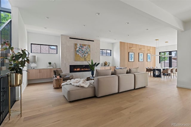 171 S Dexter St, Denver, CO 80246 - living room with light wood finished floors, a large fireplace, plenty of natural light, and recessed lighting