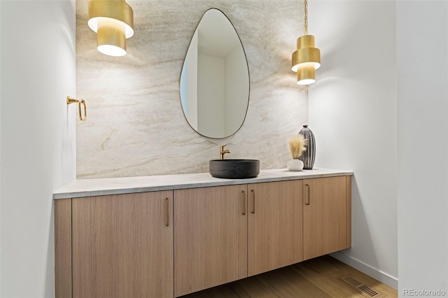 171 S Dexter St, Denver, CO 80246 - bathroom with vanity and wood finished floors
