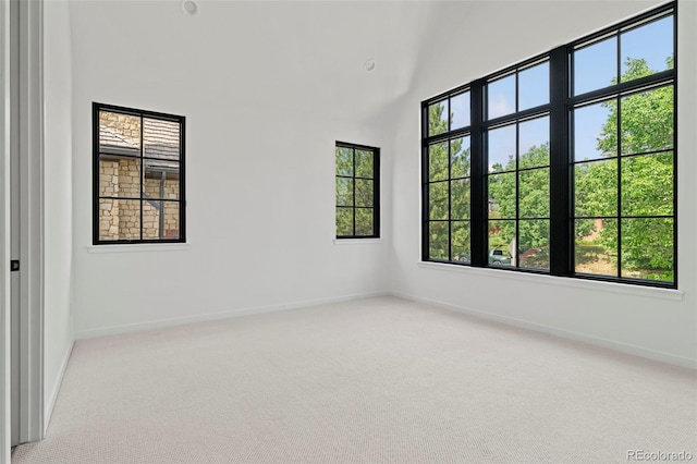 171 S Dexter St, Denver, CO 80246 - unfurnished room featuring carpet floors and high vaulted ceiling