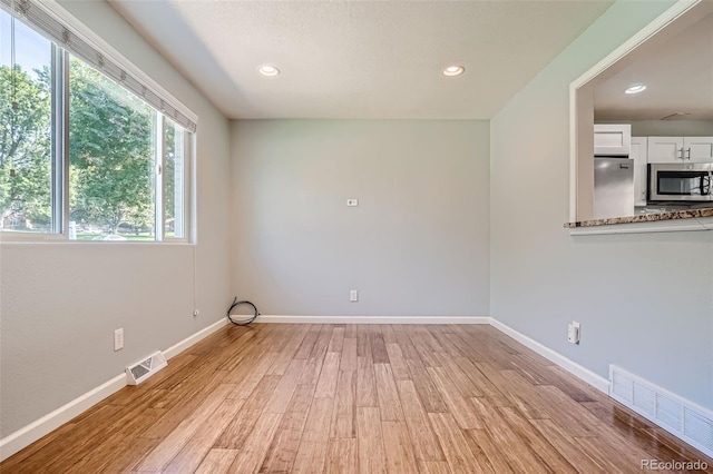 empty room featuring light hardwood / wood-style floors