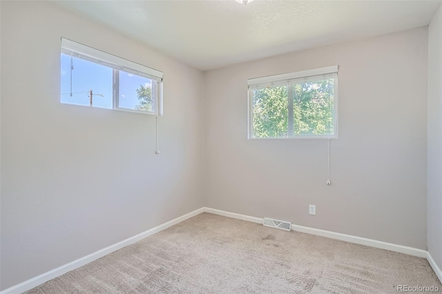 spare room with carpet floors