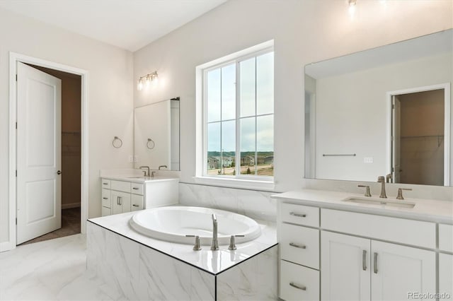 4978 Hickory Oaks St, Castle Rock, CO 80104 - bathroom featuring two vanities, a bath, marble finish floors, and a spacious closet