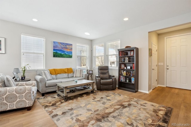 3178 Geneva Ct, Denver, CO 80238 - living area featuring wood finished floors, recessed lighting, and baseboards
