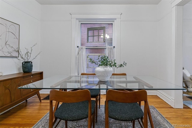 dining space featuring light wood-type flooring