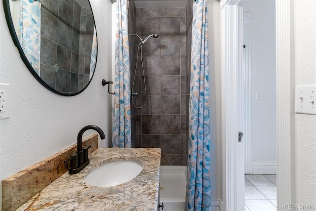 bathroom featuring tile patterned flooring, shower / tub combo with curtain, and vanity