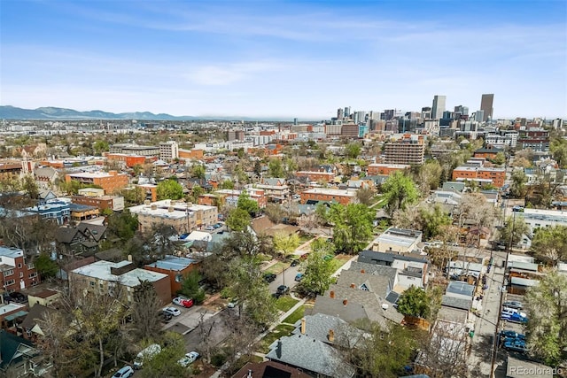drone / aerial view featuring a view of city and a mountain view