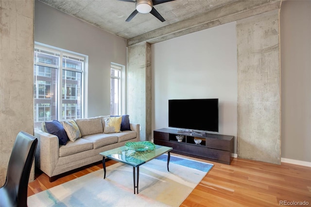 living area featuring ceiling fan and wood finished floors