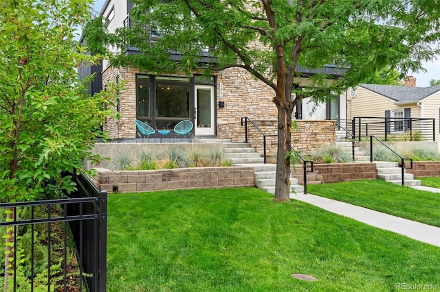 entrance to property featuring a yard