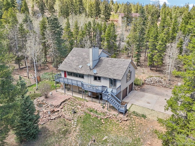 10469 Christopher Dr, Conifer, CO 80433 - view of subject property with a heavily wooded area