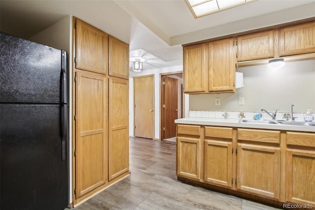 10469 Christopher Dr, Conifer, CO 80433 - kitchen featuring freestanding refrigerator, a sink, and light countertops