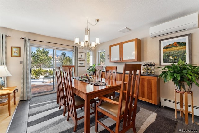 dining area featuring a wall mounted air conditioner, a textured ceiling, a baseboard radiator, and a chandelier