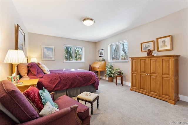 carpeted bedroom with multiple windows