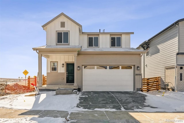 view of front of property with a garage, board and batten siding, and concrete driveway