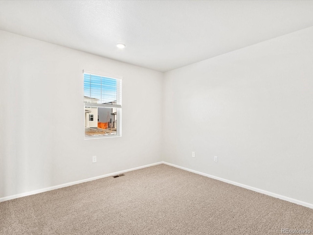 view of carpeted spare room