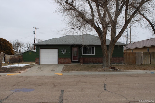 single story home featuring a garage